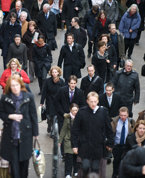 Crowd of people in street, commuters